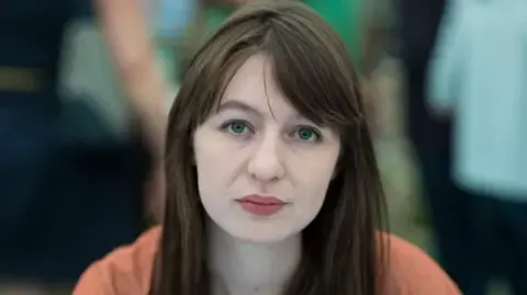 Irish author Sally Rooney claims she cannot travel to the UK over potential arrest